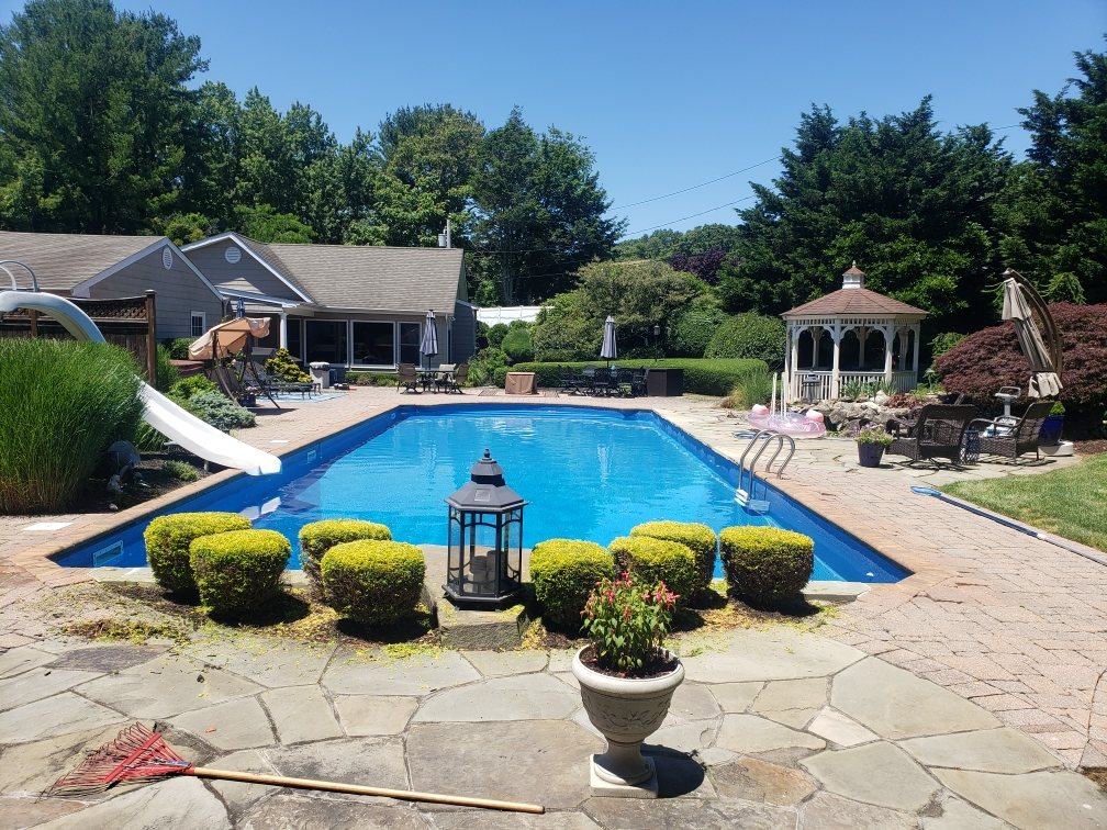 Clean pool and patio area after outdoor maintenance